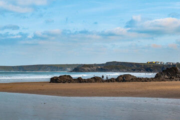 coastline cliffs, golden sands and blue sea beach and rockpools