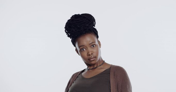 Portrait, shock and confused with an offended black woman in studio on a white background in disbelief. Bad, facial expression and wtf with an attractive young female person hearing negative gossip