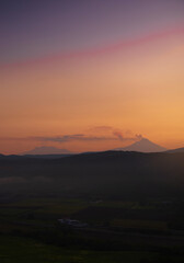 Panoramic view of the Popocatepetl volcano erupting, volcano emitting smoke, active volcano. Panoramic view of the famous volcanoes in the Valley of Mexico City.