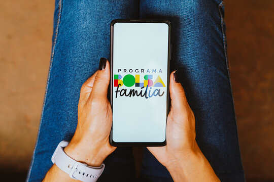 May 24, 2023, Brazil. In this photo illustration, the Bolsa Fam&iacute;lia logo is displayed on a smartphone screen.