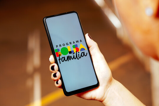 May 24, 2023, Brazil. In this photo illustration, the Bolsa Fam&iacute;lia logo is displayed on a smartphone screen.