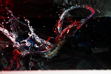 colorful splash of water on black background - 605817039