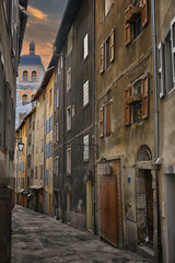 Fototapeta premium Narrow Medieval street at dusk