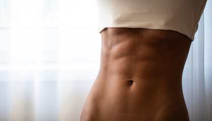 Fitness as a lifestyle. Close up of fit female body
