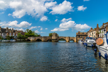 Naklejka premium A view down the River Great Ouse at the quayside in St Ives, Cambridgeshire in summertime