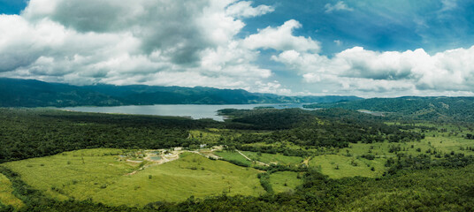 Obraz premium Amazing view of beautiful nature in Costa Rica. Green trees growing in rainy forest on gloomy day in costa rica