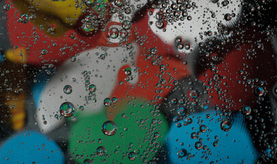 Abstract photography. Color spots are red, blue, yellow, green, black, white, silvery. Drops,...