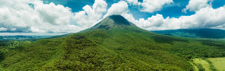 Amazing view of beautiful Arenal volcano in Costa Rica. Panorama of volcano Arenal reflected on...