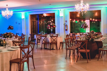 a ballroom with organized tables and chairs