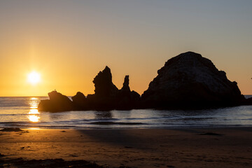 sunset on the rocky beach