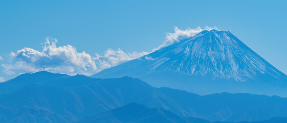 Japan. Kawaguchiko. Fuji,  Landscape of Japan . Business card of Japan. Panorama of Mount Fujiyama.  Mountain ranges against the blue sky.