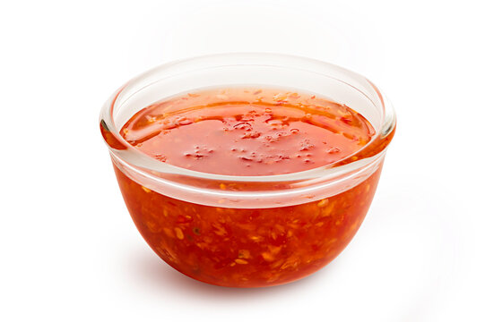 Sweet chili sauce in glass bowl isolated on white background.