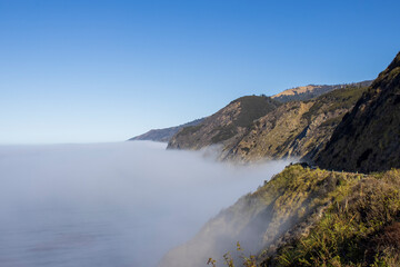 morning sea mist in the mountains next to the sea