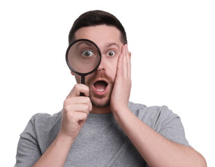 Surprised man looking through magnifier glass on white background