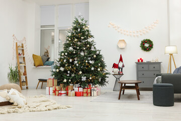 Beautiful Christmas tree and gift boxes in living room. Interior design