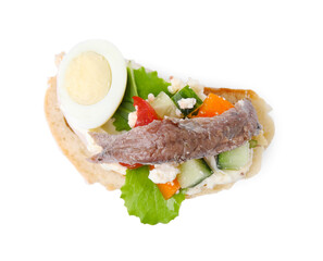 Delicious bruschetta with anchovies, eggs, tomatoes, bell peppers and cucumbers isolated on white, top view