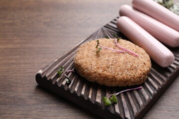 Different vegan products on wooden table, closeup. Space for text