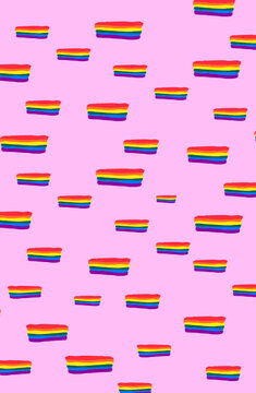 Imagen vertical de banderas lgbtq en patrones sobre un fondo rosado