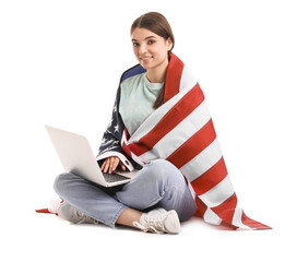 Fototapeta Young woman with USA flag using laptop on white background obraz
