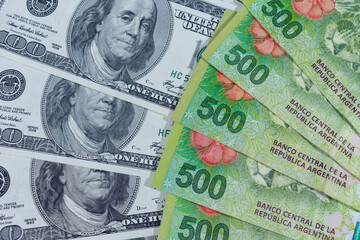 100 dollar bills and 500 argentinian peso bills. In Argentina the dollar continues to increase its...