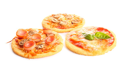 Different tasty mini pizzas on white background