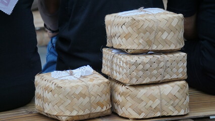 Indonesian rice box. This box is made of woven bamboo. This menu usually contains rice, fried chicken, fried noodles, pickles etc