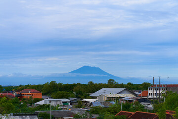 Landscape views of the majestic volcano Agung over the rooftops of the town at its foot