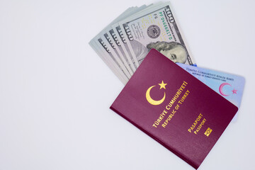 passport and identity card republic of turkey with usd dollars on white