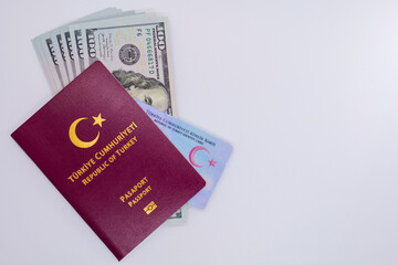 passport and identity card republic of turkey with usd dollars on white