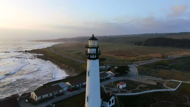 Lighthouse Pigeon Point sunset aerial Cinematic drone coastline wave crashing Santa Cruz Half Moon Bay Davenport Big Sur coastal Highway 1 California deep blue ocean spring forward motion