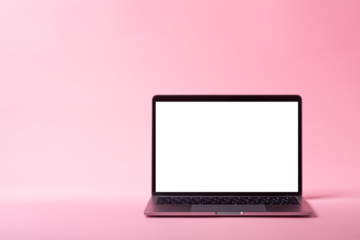 ピンク色の背景とノートパソコン