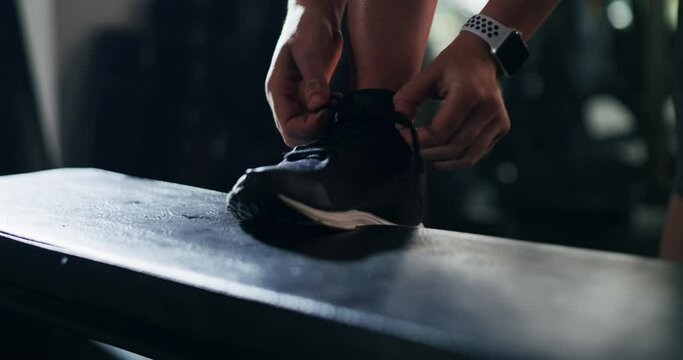 Tying lace, hands and shoes for exercise, training or running at the gym. Fitness, start and an athlete person tightening shoelaces on feet ready for sports, workout or cardio at a health club
