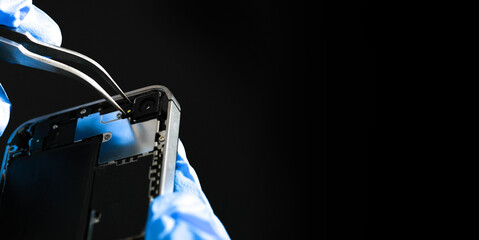 Technician repairing the Cell phone parts and tools for recovery repair phone smartphone and...