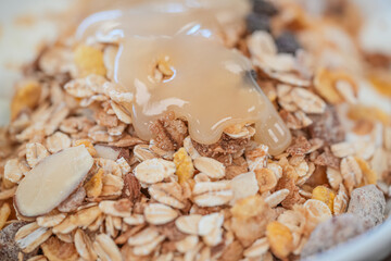 Organic fresh honey with cereal for breakfast