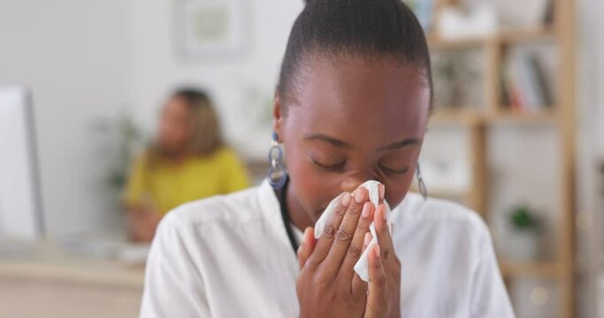Woman, tissue and blowing nose in office for cold, allergies and medical virus. Business, sick and black female sneezing for health problem, covid risk and allergy of sinusitis, infection and disease