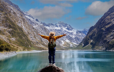 Happy young woman  look on the mountain landscape. Travel and active life concept  as Adventure...