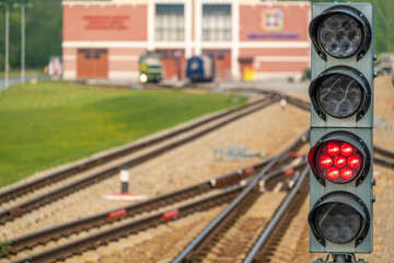 Semaphore on railway tracks on a sunny day. Rails with traffic lights.
