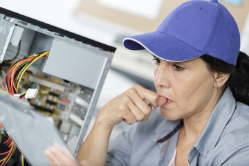 a middle-aged checking a computer