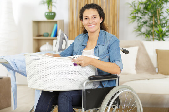 happy woman in wheelchair iron
