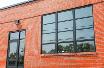 A towering brick business complex embodies strength, stability, and professionalism in its architecture, reflecting the success and longevity of the companies housed within