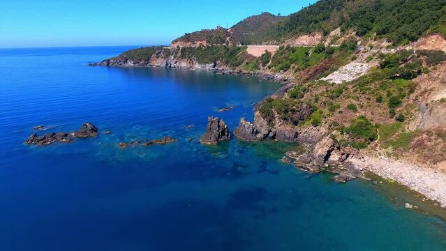 very beautiful paradise cove under a hill with a transparent blue turquoise sea jijel algeria
