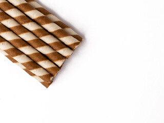 Wafer rolls with chocolate isolated on white background.