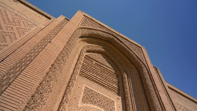 Facade of Abbasid palace, Baghdad in Iraq. Low angle with blue sky in background