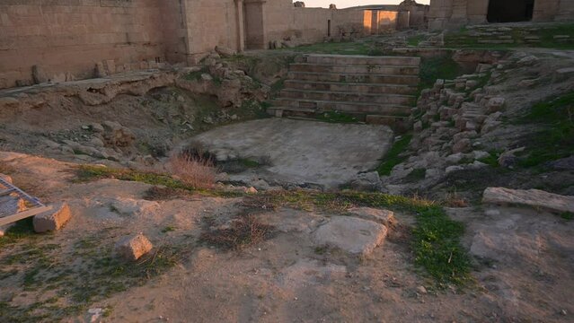 Building ruins of Hatra with doorway in background, Iraq. First-person view