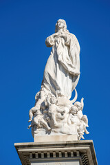 Fototapeta na wymiar Monument to the Immaculate Conception in Triunfo Square, historic center of Seville, Spain.