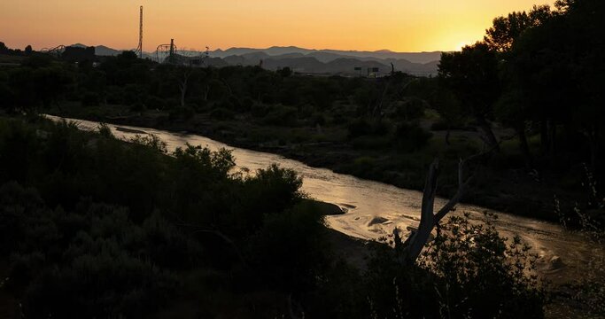 Timelapse of the Santa Clara River running through Santa Clarita, Ca. with Six Flags Magic Mountain in the distant background.