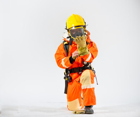 The firefighter's dexterity is evident as he adjust the glove ensuring optimal finger movement and tactile sensitivity for their demanding tasks.