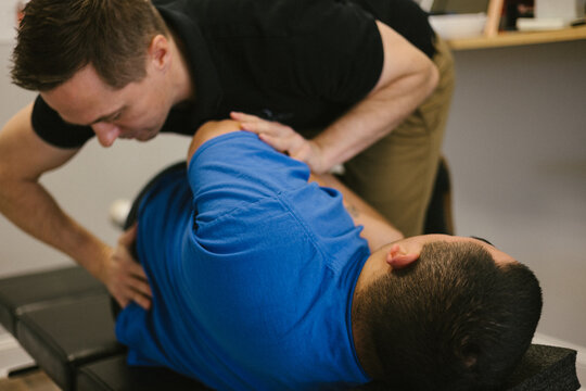 Patient receives a spinal adjustment at a chiropractic office