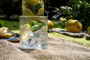 Fresh, icy citrus lemonade made from lemon and mint. Low-calorie, sugar-free summer lemonade. Naturally prepared lemonade. Photo taken with natural light.