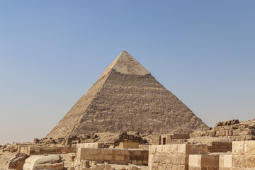 Largest pyramid on a sunny day with tombs and ruins 